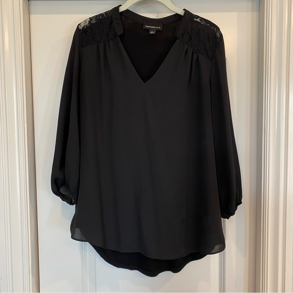 Black 3/4 sleeve hi lo blouse with lace detail. Size Large. Great condition!